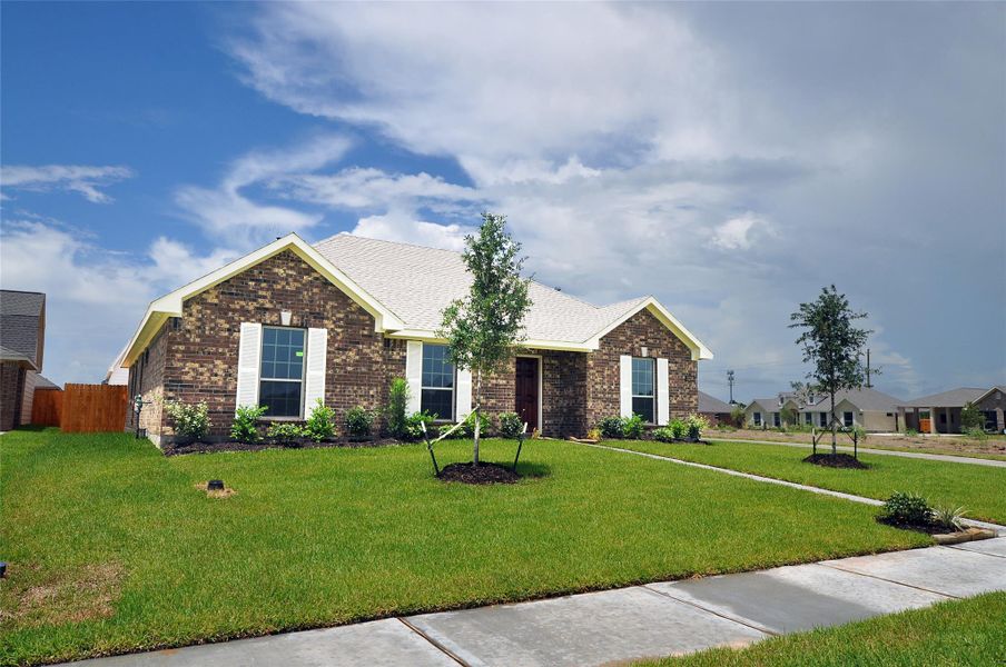 Front exterior of a new home in , League City, TX, highlighting curb appeal (Image 1). Front exterior of a new home in , League City, TX, highlighting curb appeal (Image 1).