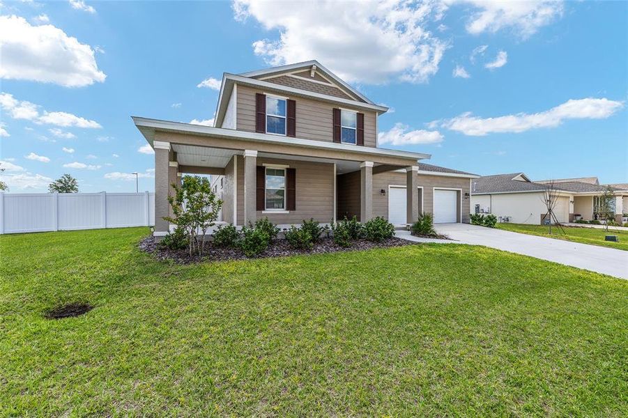 Front exterior of a new home in Calesa Township, Ocala, FL, highlighting curb appeal (Image 2). Front exterior of a new home in Calesa Township, Ocala, FL, highlighting curb appeal (Image 2).