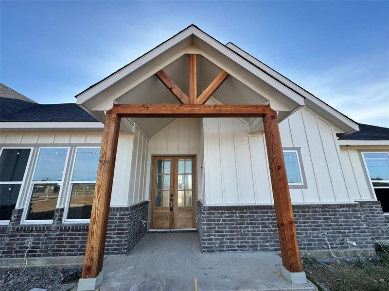 View of exterior entry featuring french doors