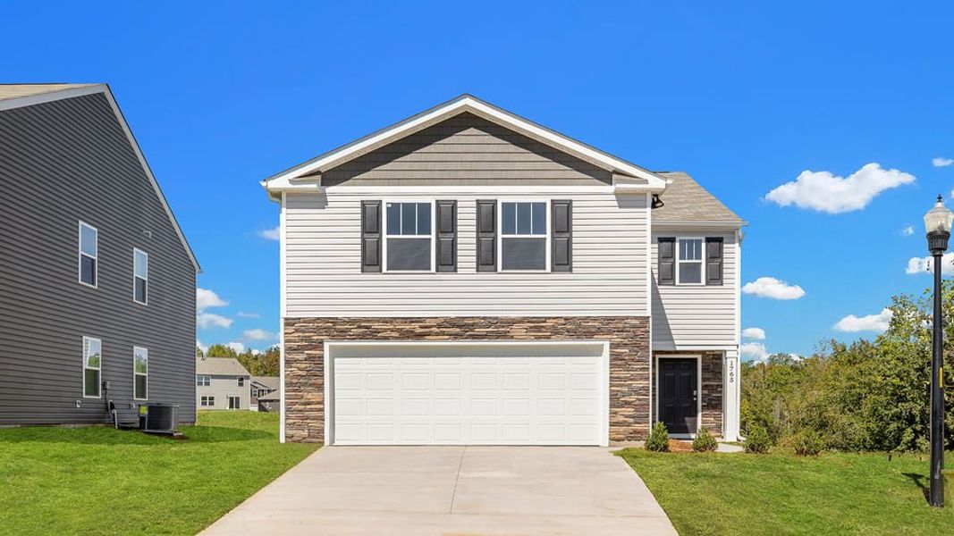 Front exterior of a new home in Paddock Point, Roebuck, SC, highlighting curb appeal (Image 1). Front exterior of a new home in Paddock Point, Roebuck, SC, highlighting curb appeal (Image 1).