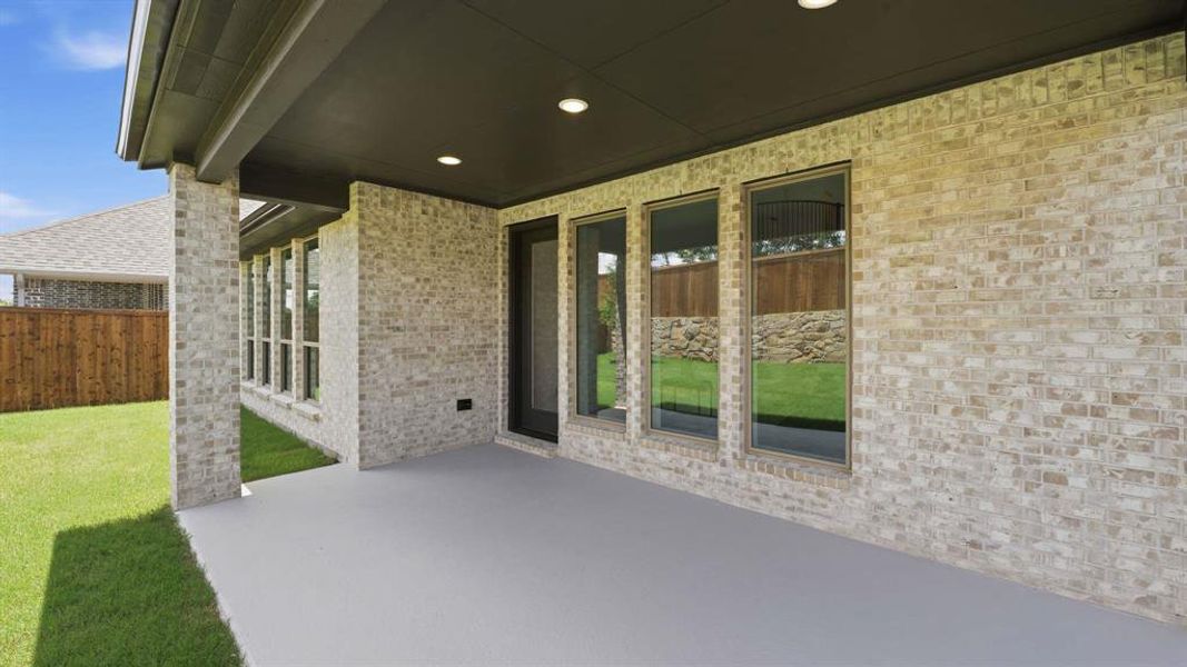 Exterior details and patio area of a home in The Heights at Uptown Celina, Celina (Image 2).
