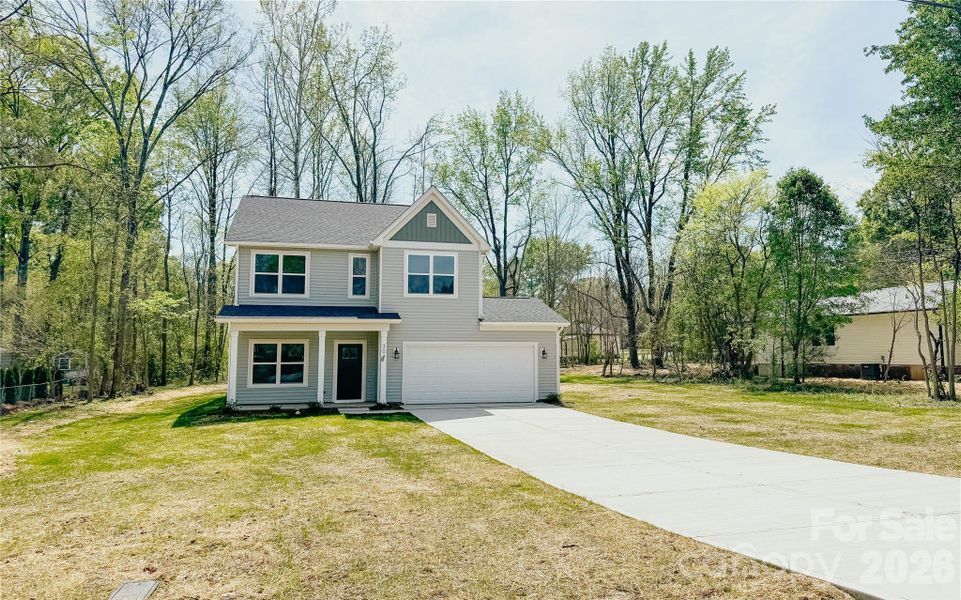 Front exterior of a new home in , Harrisburg, NC, highlighting curb appeal (Image 18).