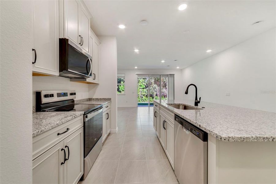 Furnished interior view inside a new home in Towns at Greenleaf, Oviedo (Image 8).