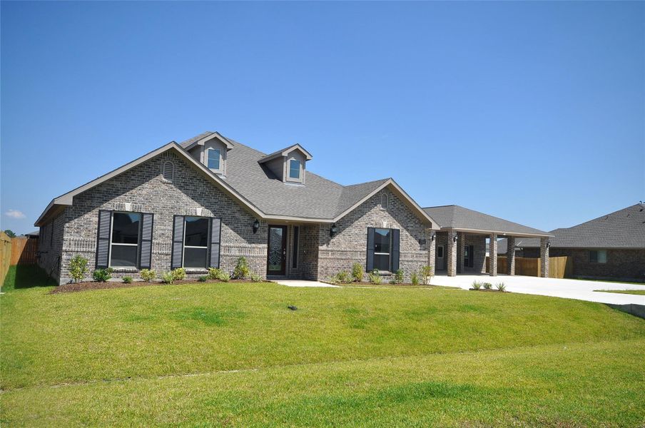 Front exterior of a new home in Pedregal, League City, TX, highlighting curb appeal (Image 26).