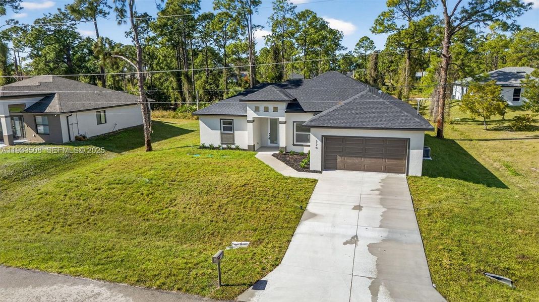 Front exterior of a new home in , Lehigh Acres, FL, highlighting curb appeal (Image 21).