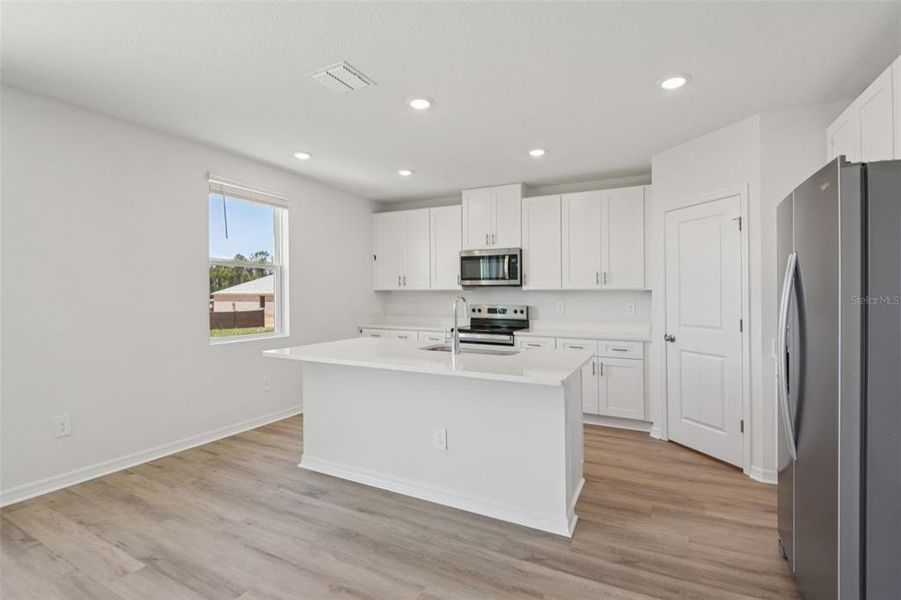 Furnished interior view inside a new home in Hilltop Vistas, Dade City (Image 5).