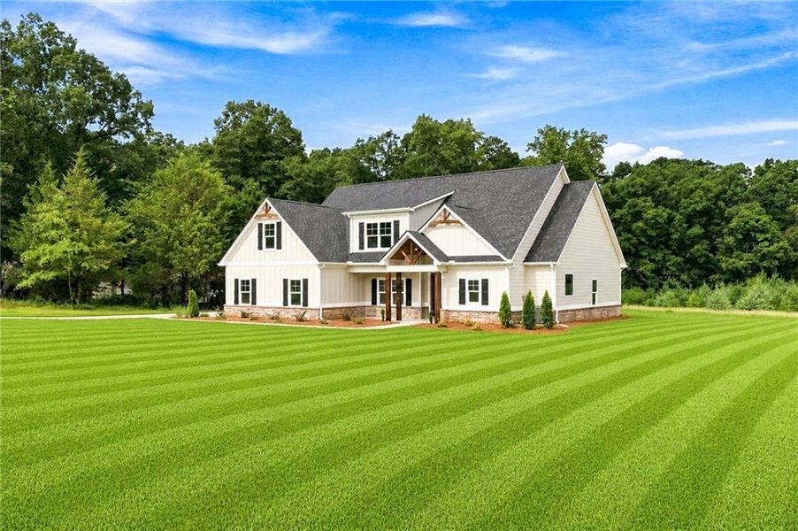 Front exterior of a new home in , Hampton, GA, highlighting curb appeal (Image 23).