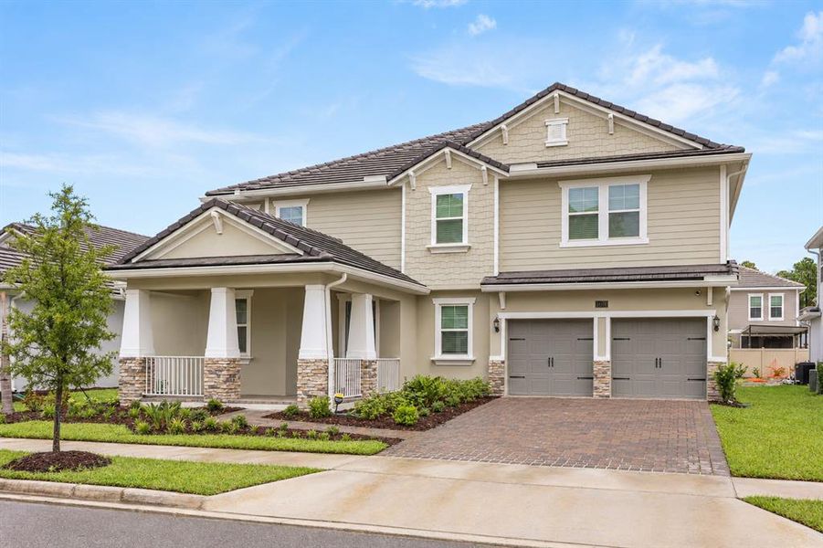 Front exterior of a new home in Palms at Windermere, Windermere, FL, highlighting curb appeal (Image 1). Front exterior of a new home in Palms at Windermere, Windermere, FL, highlighting curb appeal (Image 1).