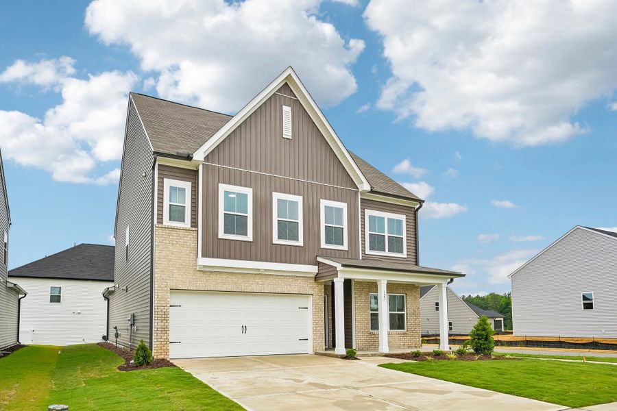 Front exterior of a new home in Crescent Mills, Wilson's Mills, NC, highlighting curb appeal (Image 20). Front exterior of a new home in Crescent Mills, Wilson's Mills, NC, highlighting curb appeal (Image 20).
