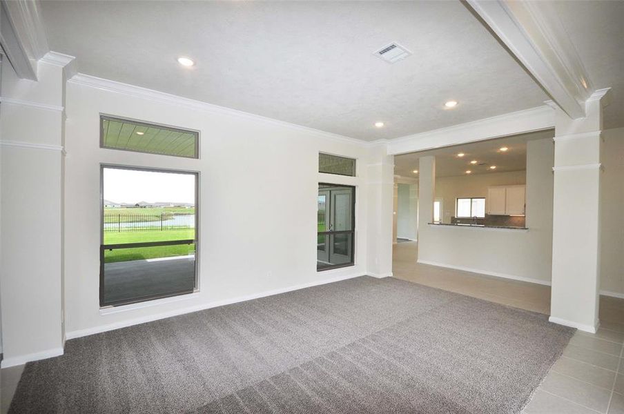 Dining Room looks out to the covered patio and the lake beyond.