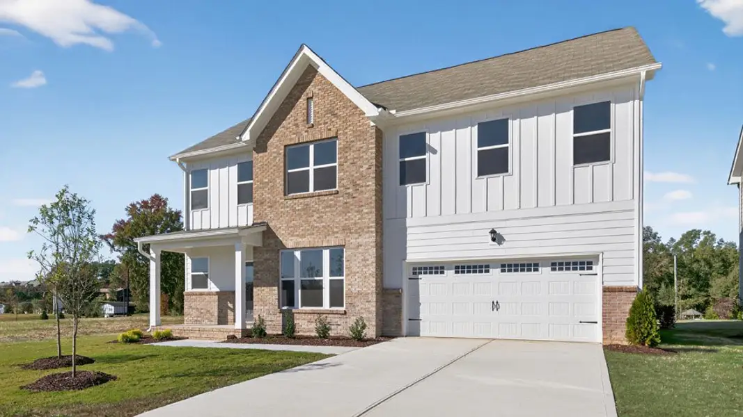 Front exterior of a new home in The Manors at Haywood Glen, Knightdale, NC, highlighting curb appeal (Image 2).