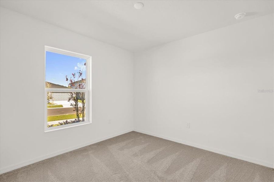 Spacious, unfurnished interior of a new home in Landings at Lake Mabel Loop, Dundee (Image 13).