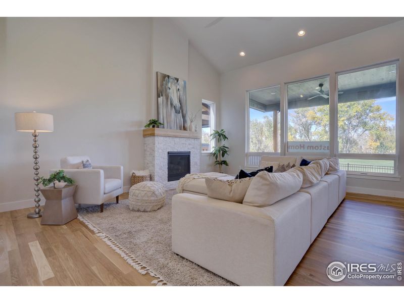 Living area is enhanced by the gas fireplace and views over the golf course