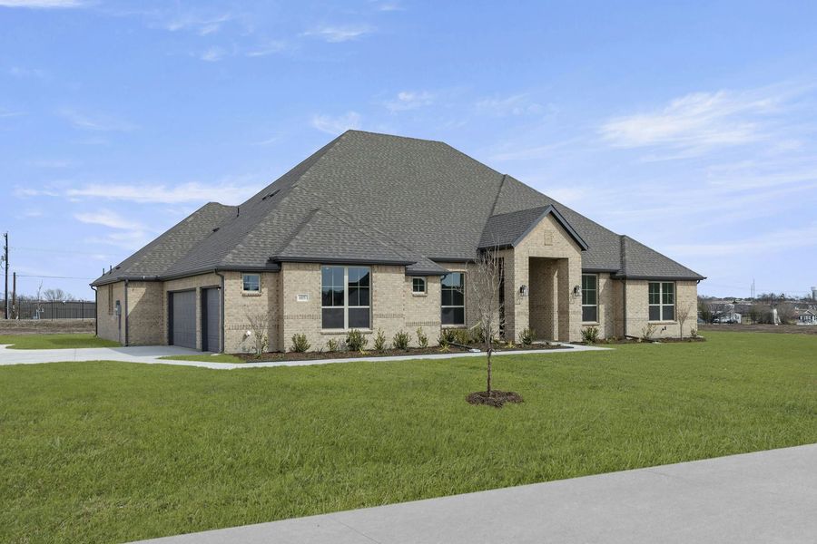 Front exterior of a new home in Berkshire Estates, Mesquite, TX, highlighting curb appeal (Image 2). Front exterior of a new home in Berkshire Estates, Mesquite, TX, highlighting curb appeal (Image 2).