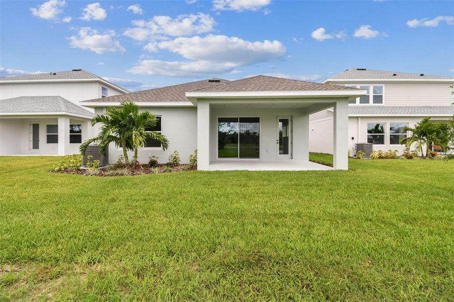 Front exterior of a new home in North River Ranch – Garden Series, Parrish, FL, highlighting curb appeal (Image 18).