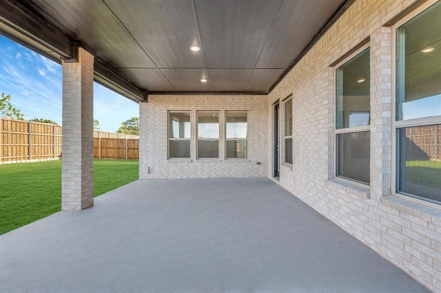 Exterior details and patio area of a home in Sterling Greene, Arlington (Image 2). Exterior details and patio area of a home in Sterling Greene, Arlington (Image 2).