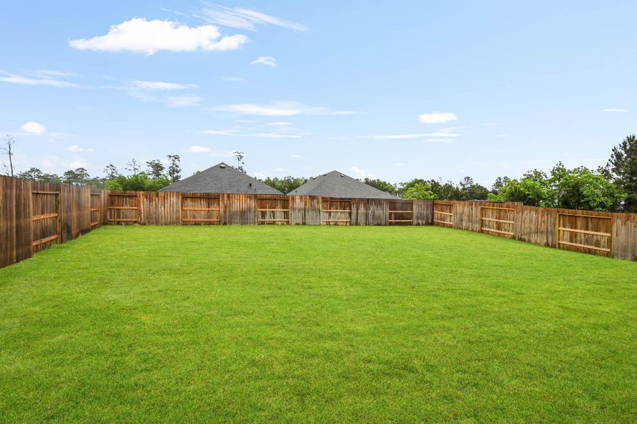 Exterior details and patio area of a home in Hills of Westlake, Conroe (Image 21).