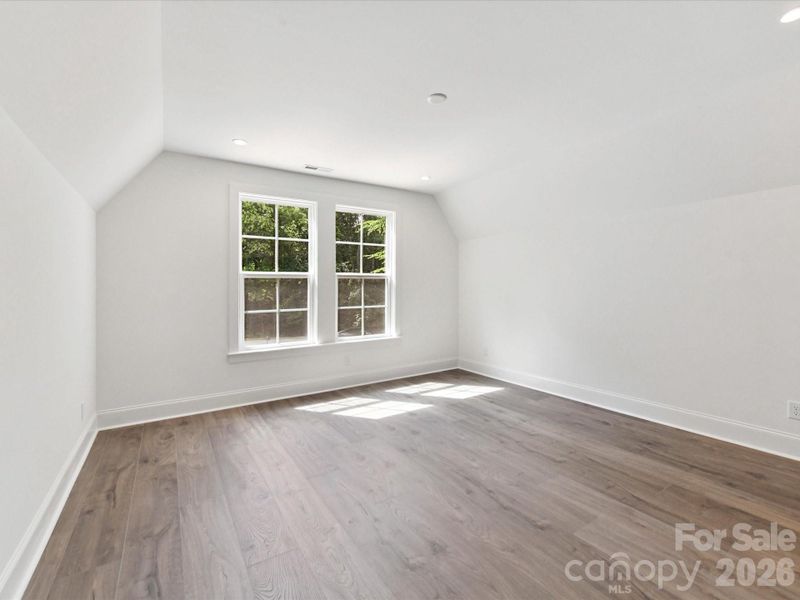 Spacious third bedroom with easy access to the Jack-and-Jill bathroom and plenty of room for guests, family, or a home office.