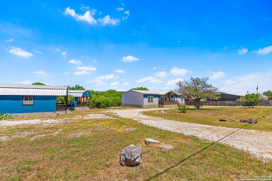 Front exterior of a new home in , Spring Branch, TX, highlighting curb appeal (Image 25).