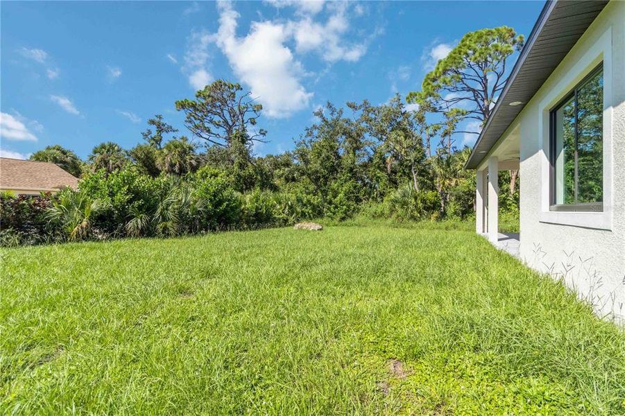Front exterior of a new home in , Rotonda West, FL, highlighting curb appeal (Image 2).