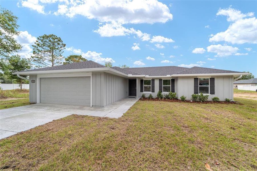 Front exterior of a new home in , Ocala, FL, highlighting curb appeal (Image 23).