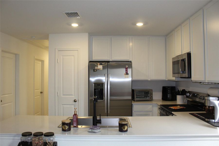 Spacious kitchen with plenty of counter space for cooking and entertaining.