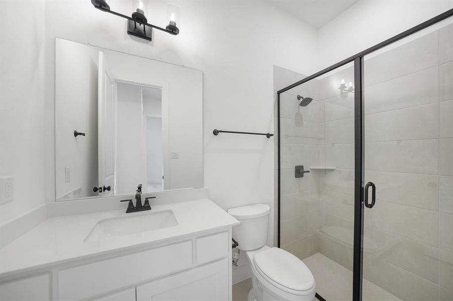 Full bath featuring vanity and a stall shower