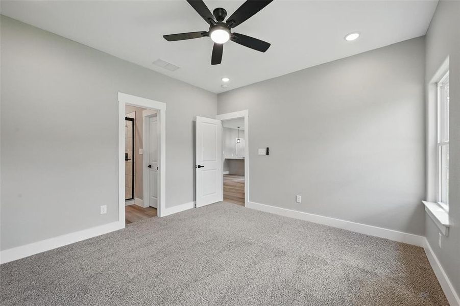 Unfurnished bedroom with carpet, baseboards, recessed lighting, and a ceiling fan