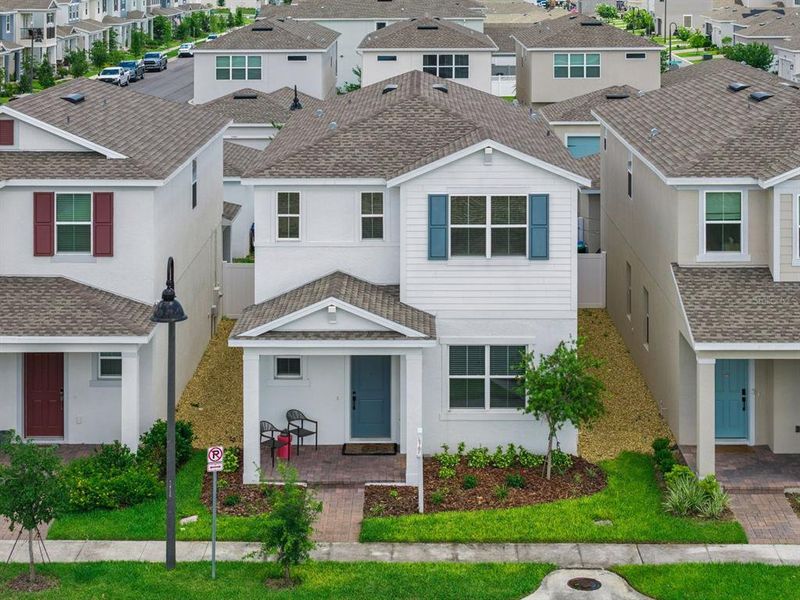 Front exterior of a new home in Osprey Ranch, Winter Garden, FL, highlighting curb appeal (Image 25).