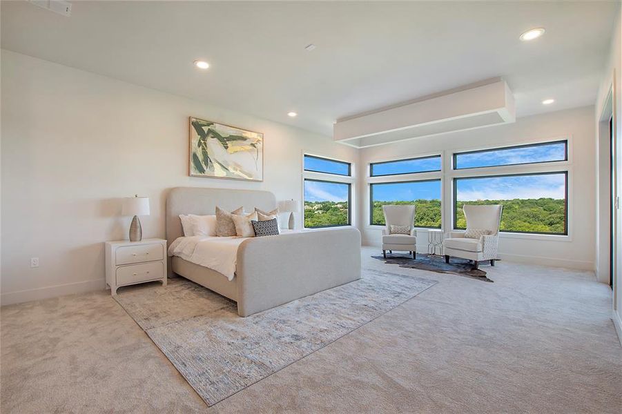 Bedroom featuring light colored carpet