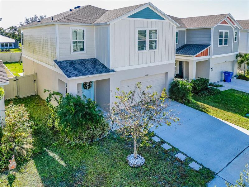 Front exterior of a new home in Pasadena Point, Wesley Chapel, FL, highlighting curb appeal (Image 30). Front exterior of a new home in Pasadena Point, Wesley Chapel, FL, highlighting curb appeal (Image 30).