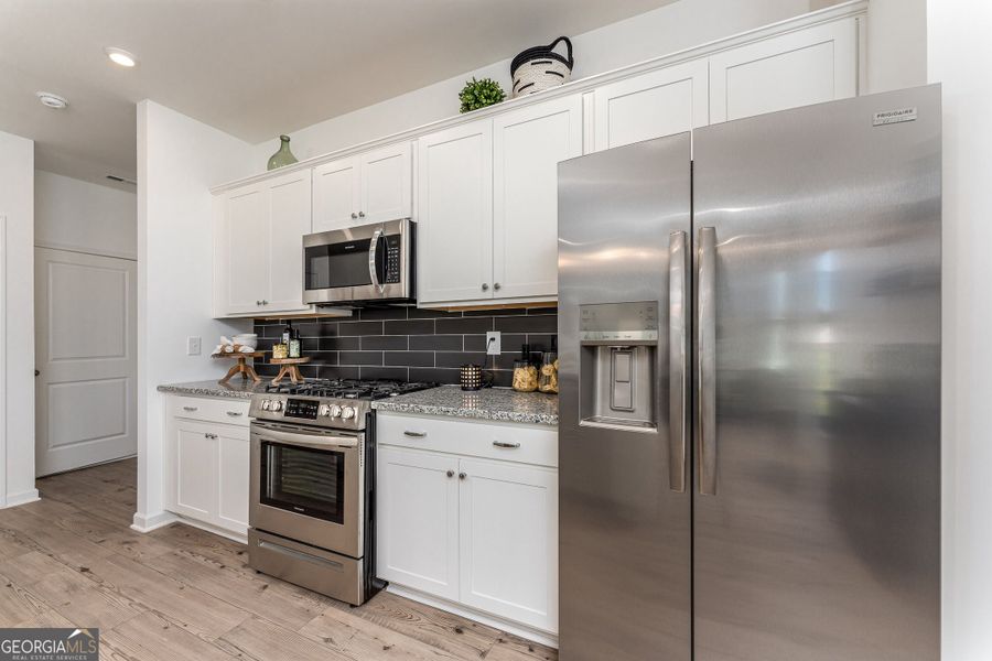 Furnished interior view inside a new home in Cobblestone Crossing Commons, Byron (Image 14).