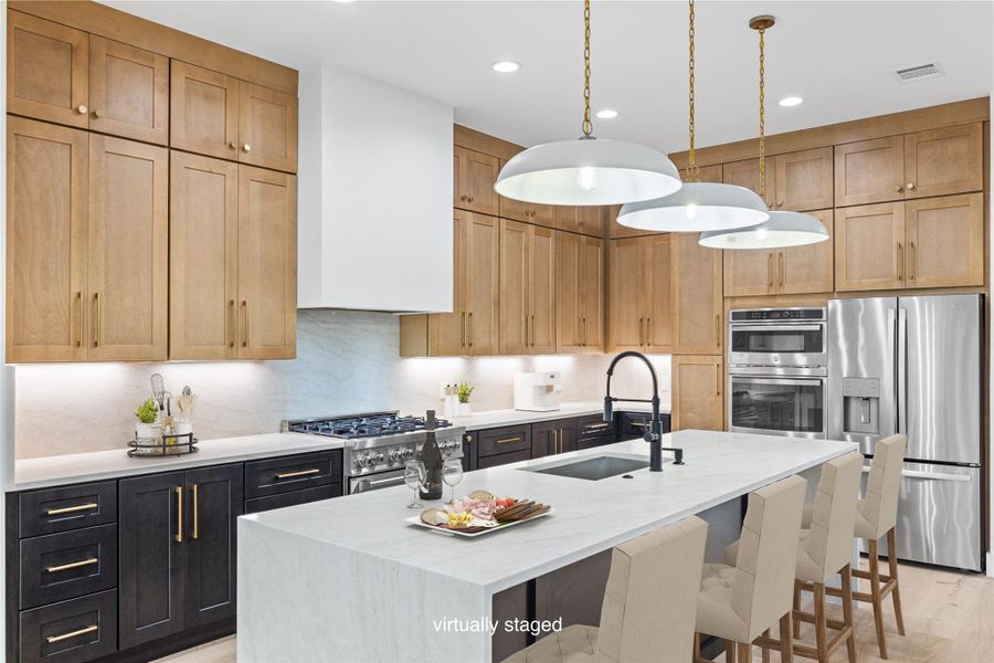 The kitchen is the vocal point with features including solid wood cabinetry, large waterfall quartz island. The kitchen is the vocal point with features including solid wood cabinetry, large waterfall quartz island.