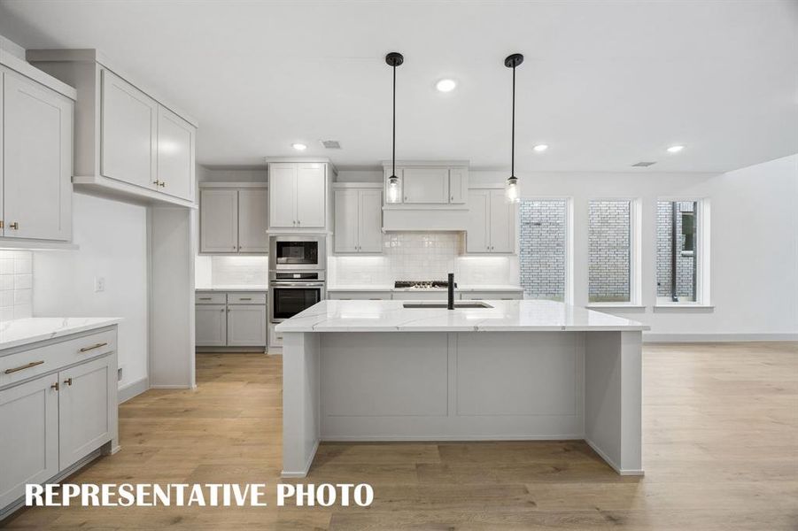 The spacious island is the hub of your new dream kitchen and offers the perfect place for friends and family to gather round! The spacious island is the hub of your new dream kitchen and offers the perfect place for friends and family to gather round!