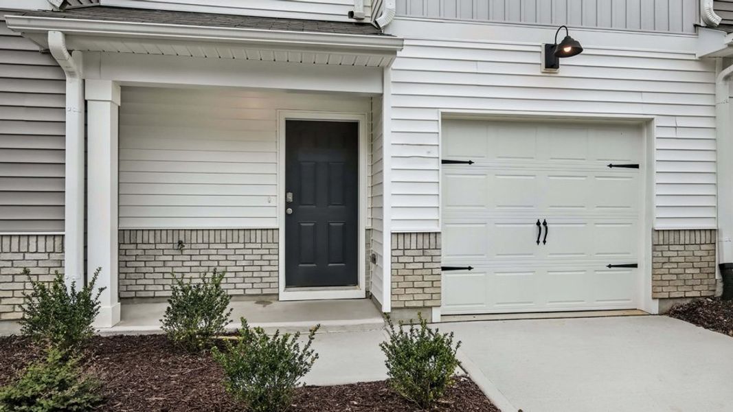Exterior details and patio area of a home in The Townes at Honeycutt Oaks, Angier (Image 3).