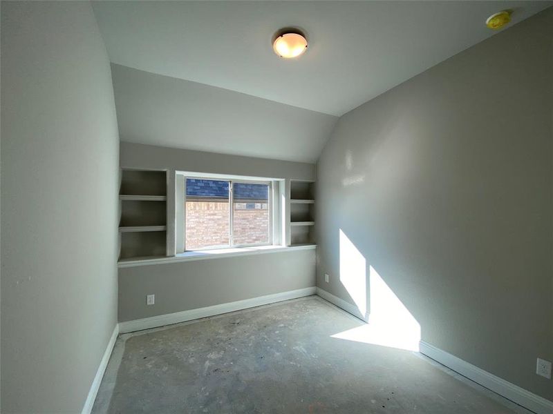 Bed 3 with vaulted ceiling & built-in shelves (light greige carpet not installed yet) Bed 3 with vaulted ceiling & built-in shelves (light greige carpet not installed yet)