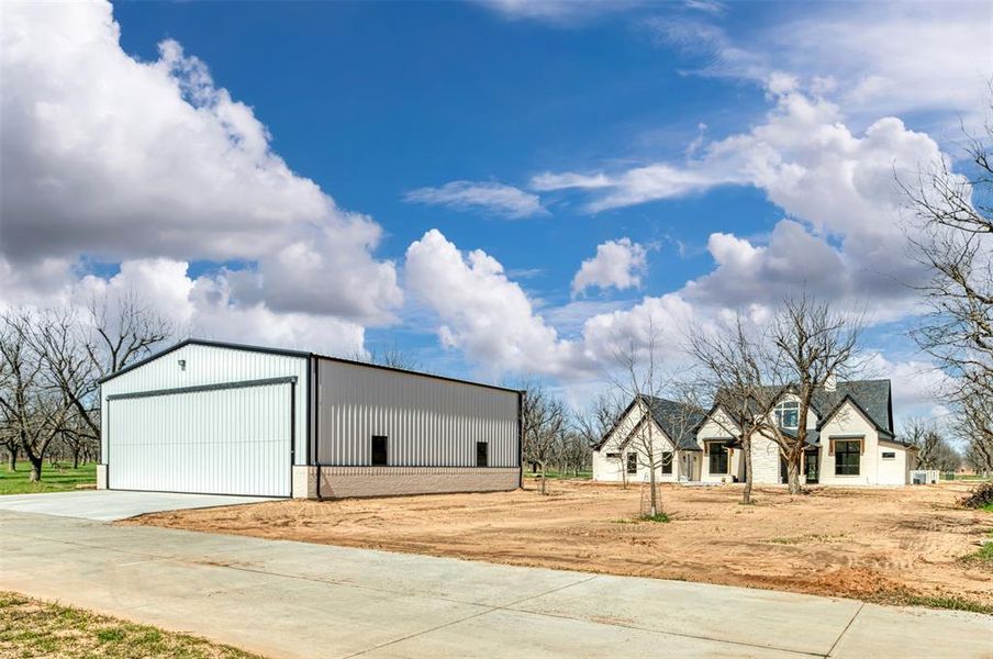Front exterior of a new home in , Granbury, TX, highlighting curb appeal (Image 23). Front exterior of a new home in , Granbury, TX, highlighting curb appeal (Image 23).
