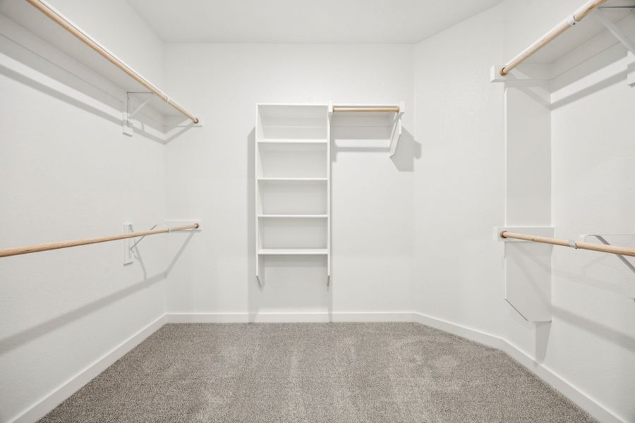 Primary Closet in the Emmy II home plan by Trophy Signature Homes - REPRESENTATIVE PHOTO Primary Closet in the Emmy II home plan by Trophy Signature Homes - REPRESENTATIVE PHOTO