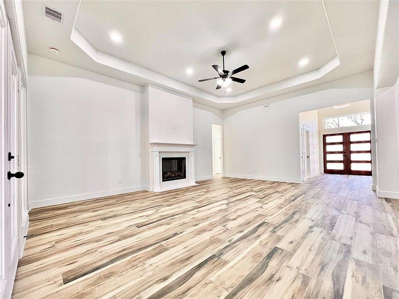 Living Room includes Ceiling Fan with Light Kit plus Can LED Lighting.