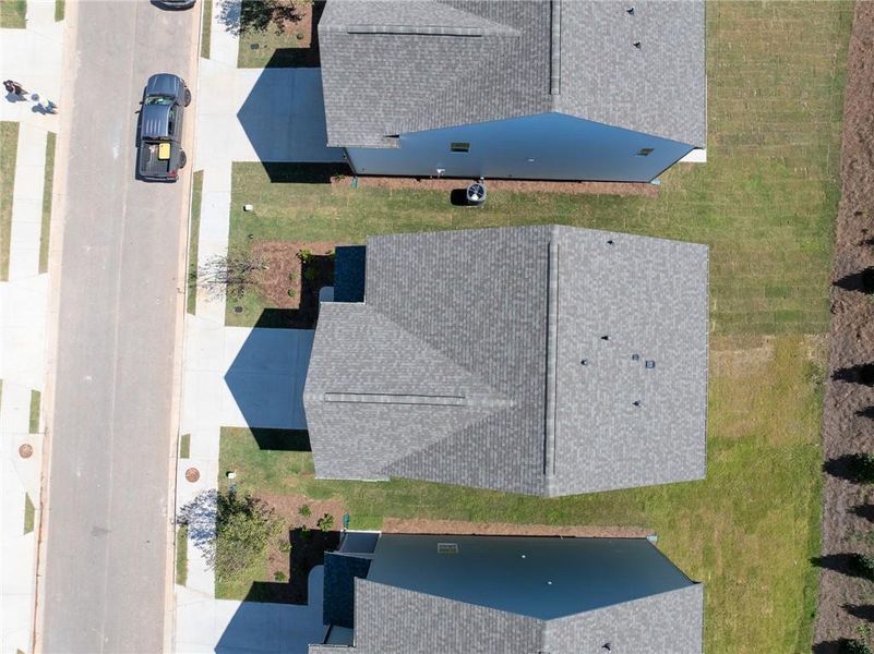 Front exterior of a new home in Annsbury Park, Lilburn, GA, highlighting curb appeal (Image 1). Front exterior of a new home in Annsbury Park, Lilburn, GA, highlighting curb appeal (Image 1).