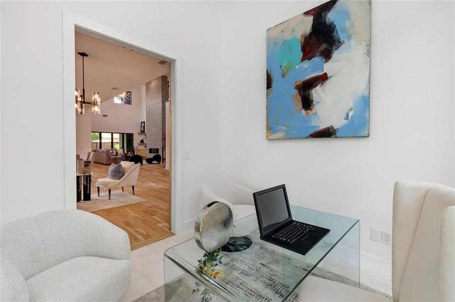 Light-filled interior space with white walls and a wide entryway Light-filled interior space with white walls and a wide entryway