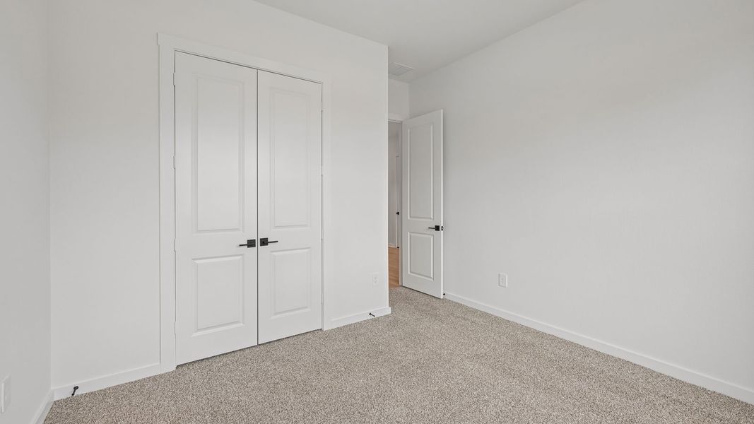 Spacious, unfurnished interior of a new home in The Enclave at Bar W Ranch, Leander (Image 26).