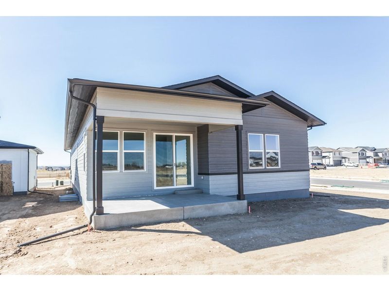 Exterior details and patio area of a home in Prairie Song Story Collection - Single Family Homes, Windsor (Image 3).
