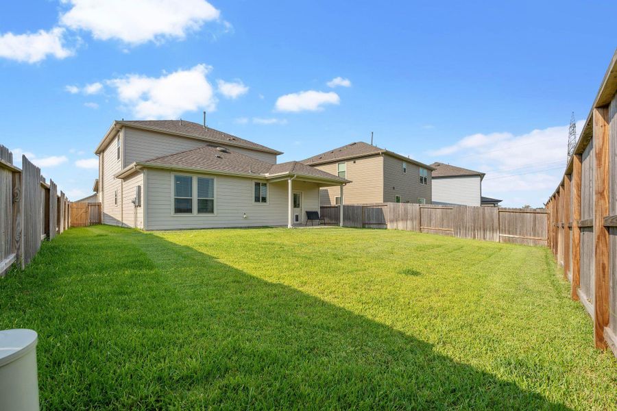 Front exterior of a new home in Myrtle Gardens, Magnolia, TX, highlighting curb appeal (Image 20). Front exterior of a new home in Myrtle Gardens, Magnolia, TX, highlighting curb appeal (Image 20).