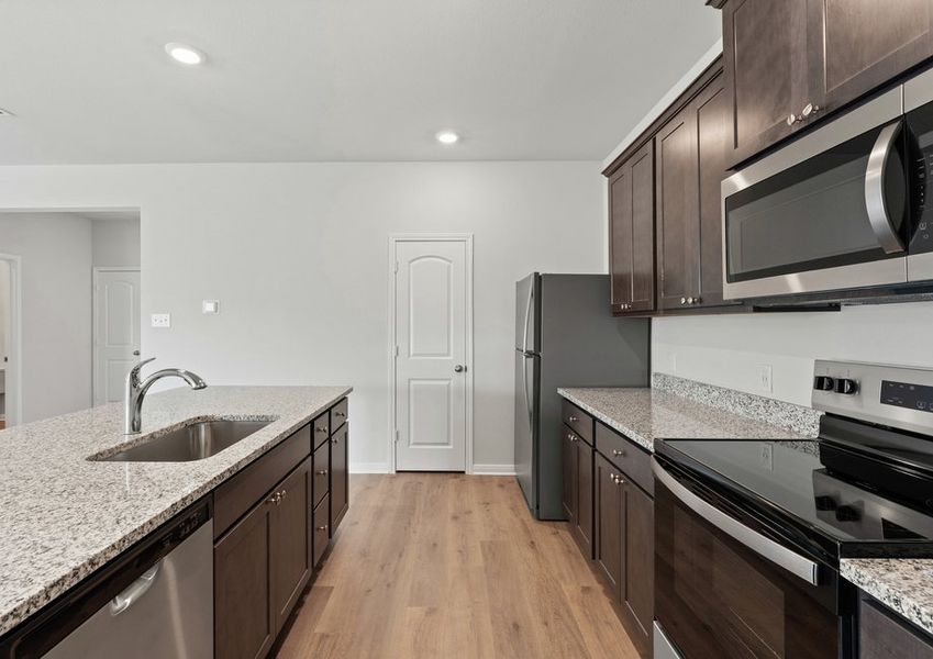 The kitchen has sprawling granite countertops. The kitchen has sprawling granite countertops.