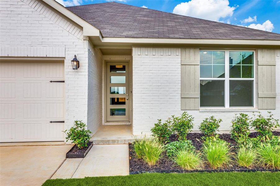 Entrance to property with a garage