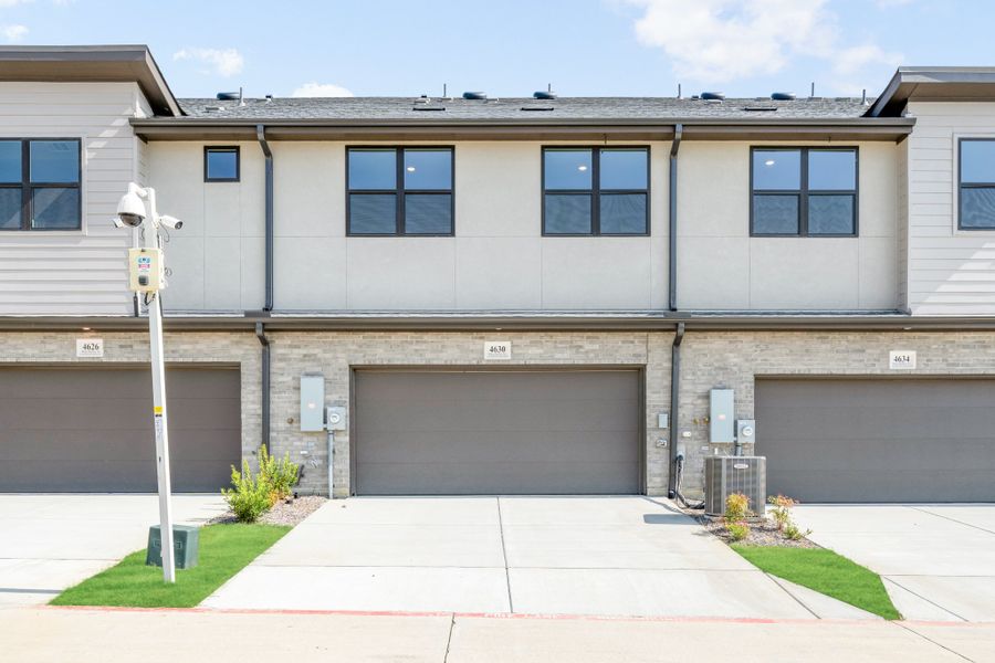 Front exterior of a new home in Wildridge, Oak Point, TX, highlighting curb appeal (Image 27). Front exterior of a new home in Wildridge, Oak Point, TX, highlighting curb appeal (Image 27).