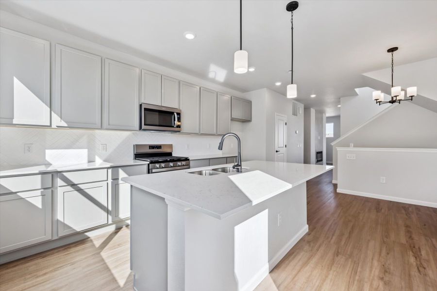 A kitchen with white cabinets. A kitchen with white cabinets.