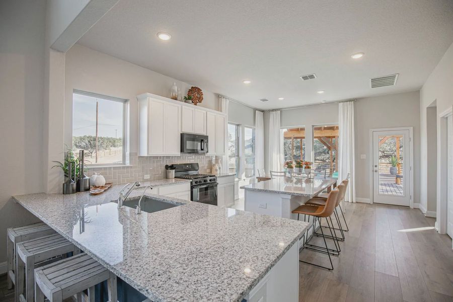 Representative furnished interior of a home built from the Lincoln by Chesmar Homes in Buffalo Crossing, Cibolo (Image 5).