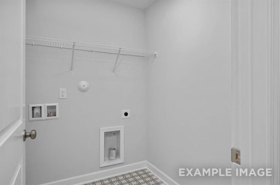 Laundry area with baseboards, washer hookup, hookup for a gas dryer, electric dryer hookup, and laundry area